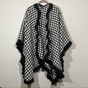 A poncho throw hounds to design one size